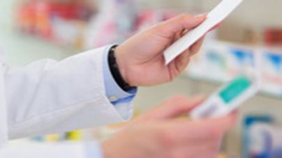 Pharmacist refilling prescription